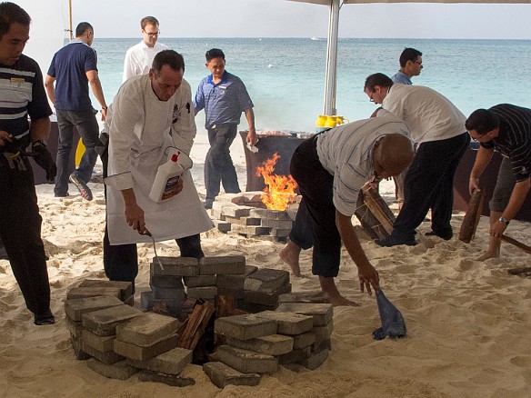The fire pits that will be used to cook the paella had to be moved 3 times because of the rising tide Jan 18, 2013 9:53 AM : Grand Cayman