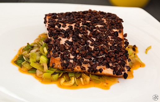 Salmon filet with cacao nibs over a bed of leeks, also sauteed in cocoa butter Jan 18, 2014 3:27 PM : Grand Cayman, Jacques Torres : Maxine Klein,David Zeleznik,Daniel Boulud