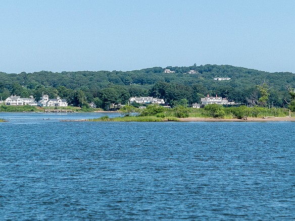 OnrustCTRiverCruise2019-013 The inlet to North Cove and the substantial shoreline mansions in Essex