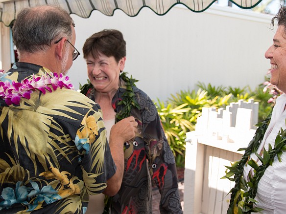 Craig Washofsky, whose folks were hosting the ceremony and reception, gives Mary and Deb their leis. May 14, 2016 3:22 PM : Craig Washofsky, Debra Zeleznik, Mary Wilkowski