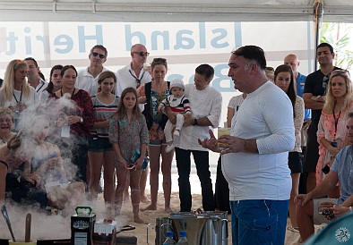 CaymanCookout2015Day1-039 Daniel Boulud watches with his newborn, as José Andrés strips out of chef jacket, pisco sour in hand