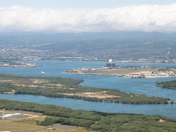 The approach into Honolulu airport is over Pearl Harbor. You can just make out the Arizona Memorial, the little white "dash" in the water at the far right, just off Ford Island. May 11, 2013 1:44 PM : Oahu