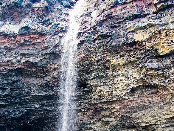 A waterfall drops right in front of the entrance to a sea cave May 14, 2013 8:23 AM : Kauai