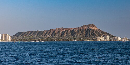 Oahu2026-025 Cruising east off Waikiki towards Diamondhead as the sun starts lowering towards the horizon. The orangish-brown haze along the horizon is the VOG (volcanic...