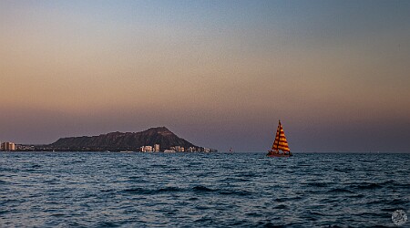 Oahu2026-027 Cruising east off Waikiki towards Diamondhead as the sun starts lowering towards the horizon. The orangish-brown haze along the horizon is the VOG (volcanic...
