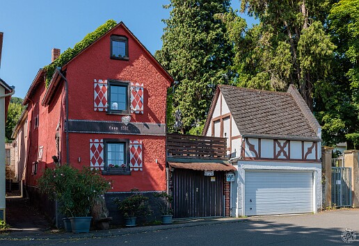 Boppard2025-012 Quaint homes along the walk into town from our dock. When the dog in the upper window failed to move or blink as we passed by, I used my binoculars to discover...
