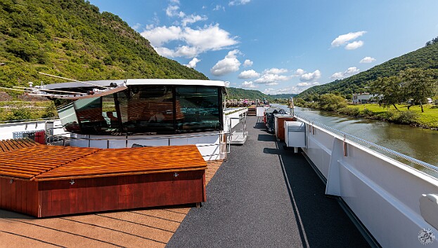 Cochem2025-010 Enjoying the beautiful weather on the top deck while cruising up the Moselle River, Reisling vineyards on either side as far as the eye can see 🍷🍷