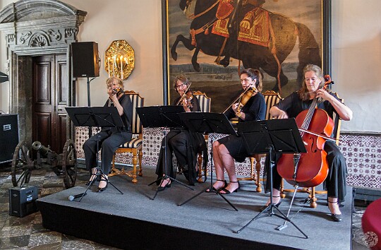 Cologne2025-005 A delightful string quartet greeted us in the main entrance hall. I believe the cannon is for those that disagreed with the choice in music.