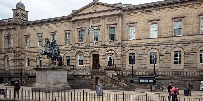 Edinburgh2024-004 The National People's Center, essentially the National Archives of Scotland, fronted by an equestrian statue of the Duke of Wellington (sans traffic safety cone...