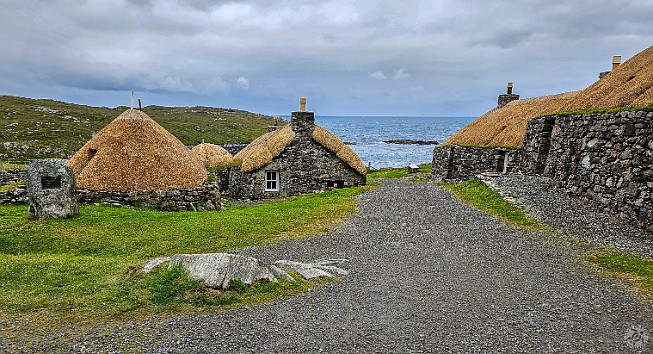 IsleOfLewisHarris2024-007 The walls of the old houses are double-thick drywall with thatched roofs that insulate from the cold and rain, while allowing the peat smoke used for heat to...