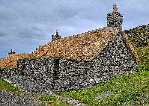 IsleOfLewisHarris2024-010 The walls of the old houses are double-thick drywall with thatched roofs that insulate from the cold and rain, while allowing the peat smoke used for heat to...