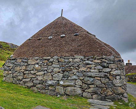 IsleOfLewisHarris2024-011 The thatched roofs held down by netting, ropes, and large stones